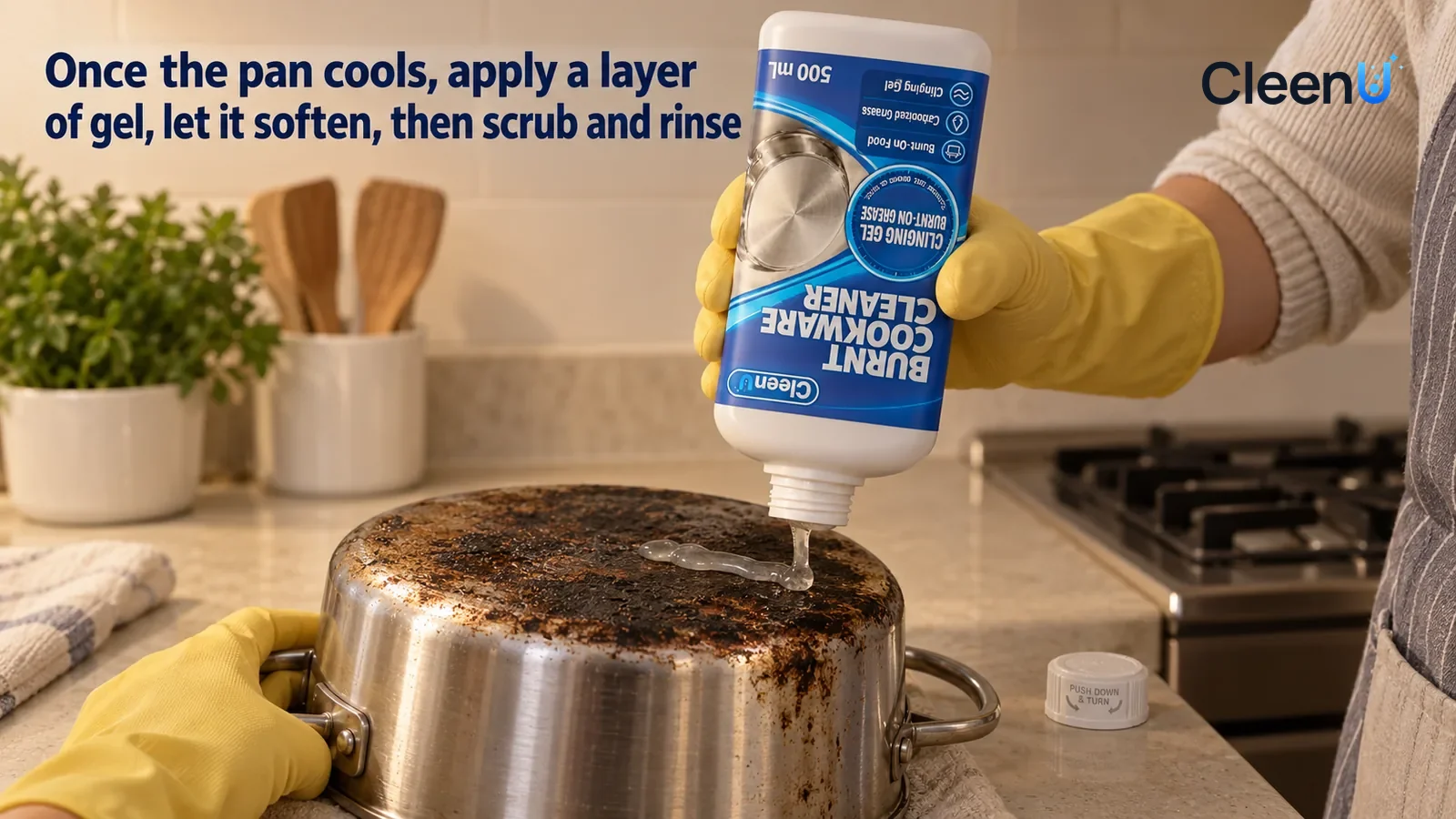 Illustration: CleenU Burnt Cookware Cleaner — A cooled stainless stockpot (no brand marks) on the counter by the stove