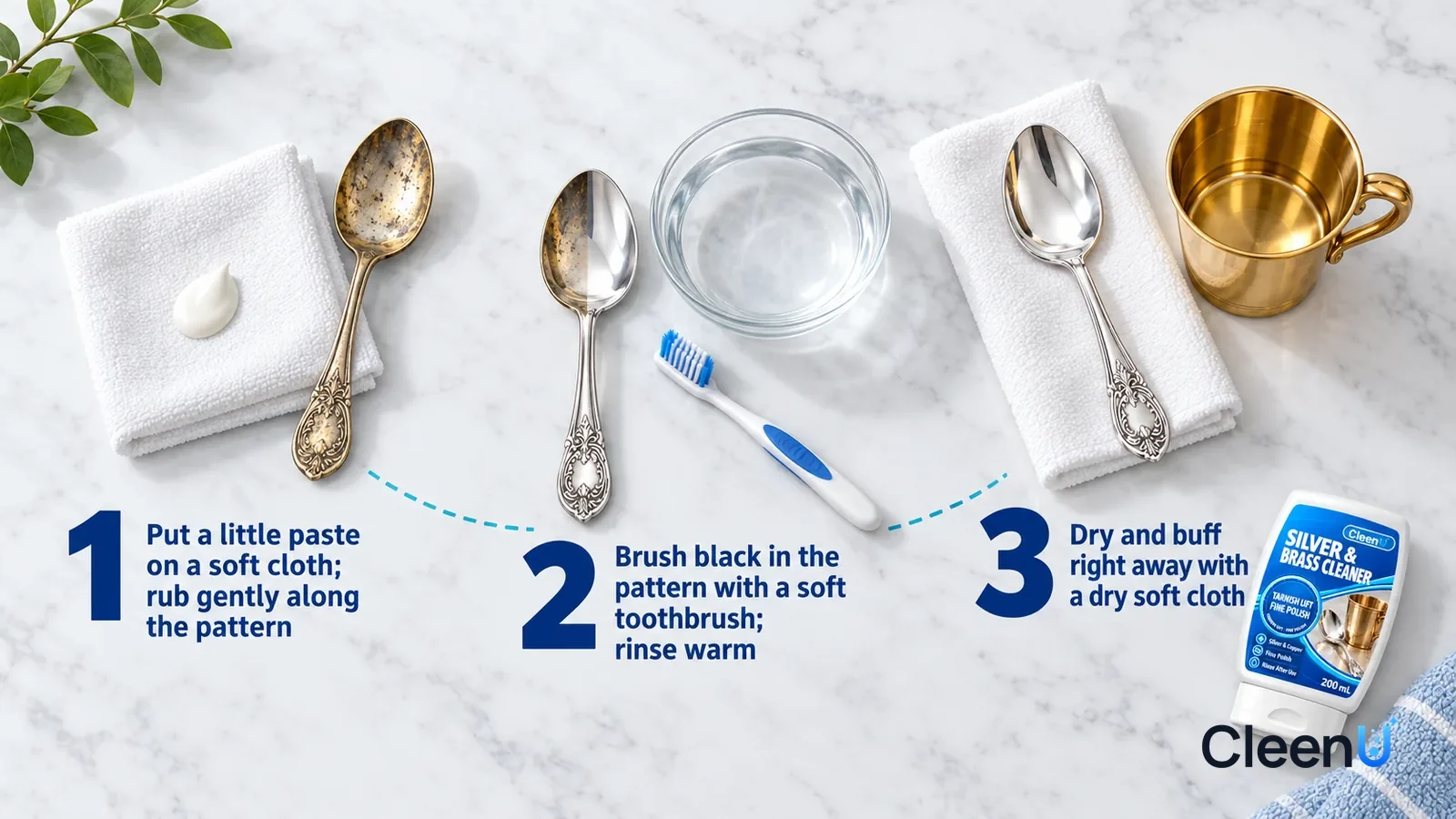 Illustration: CleenU Silver & Brass Cleaner — an overhead shot straight down onto a light marble tabletop, no bottle and no hands: (1) a folded white soft cloth with a small dab of milky
